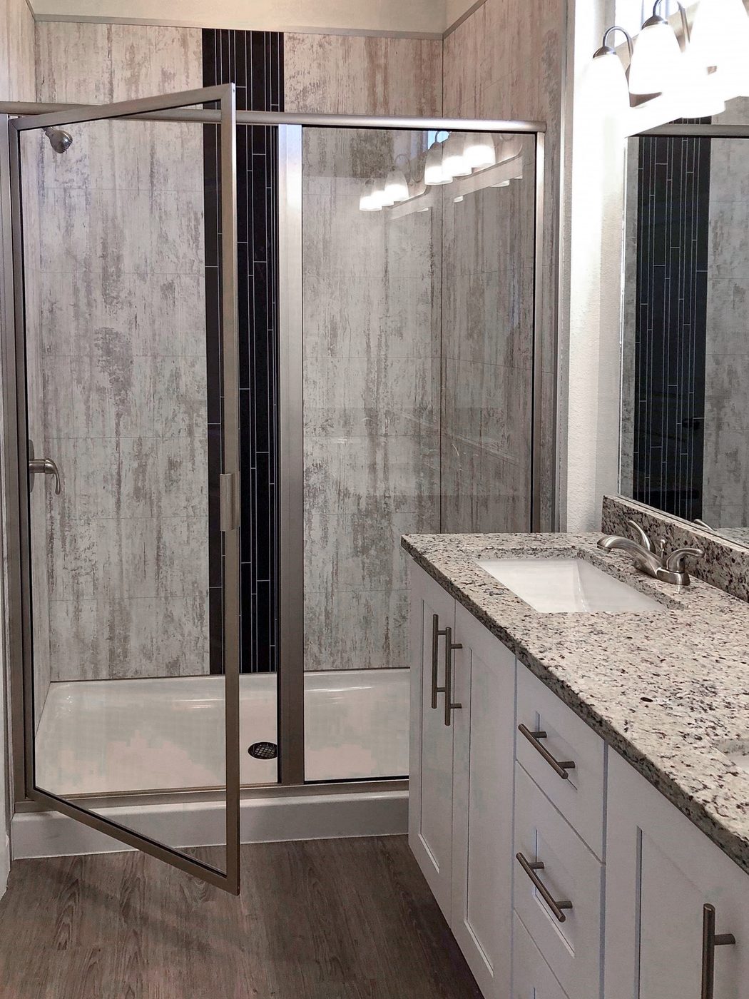 A finished bathroom with a bold vertical accent wall